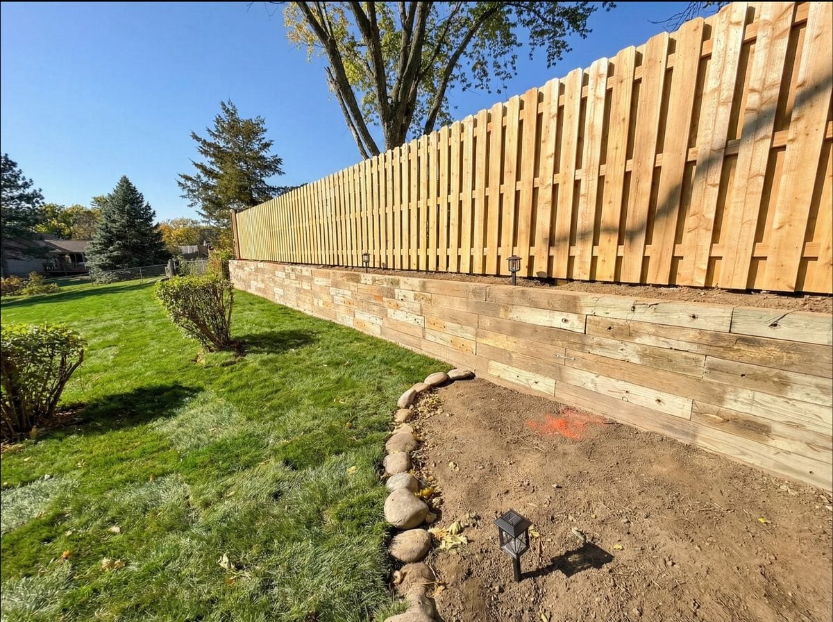 Timber retaining wall landscaped